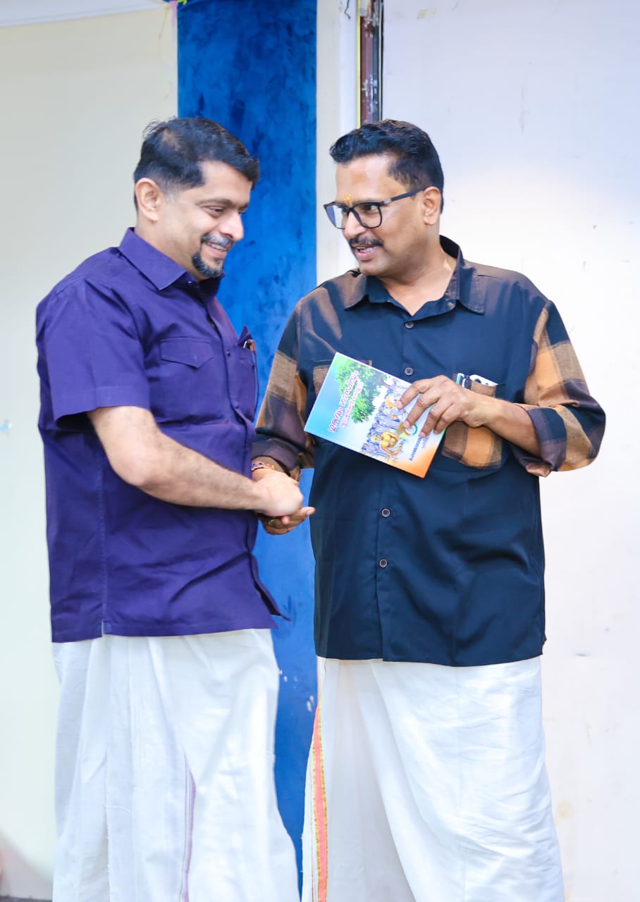 Handshake during book presentation ceremony