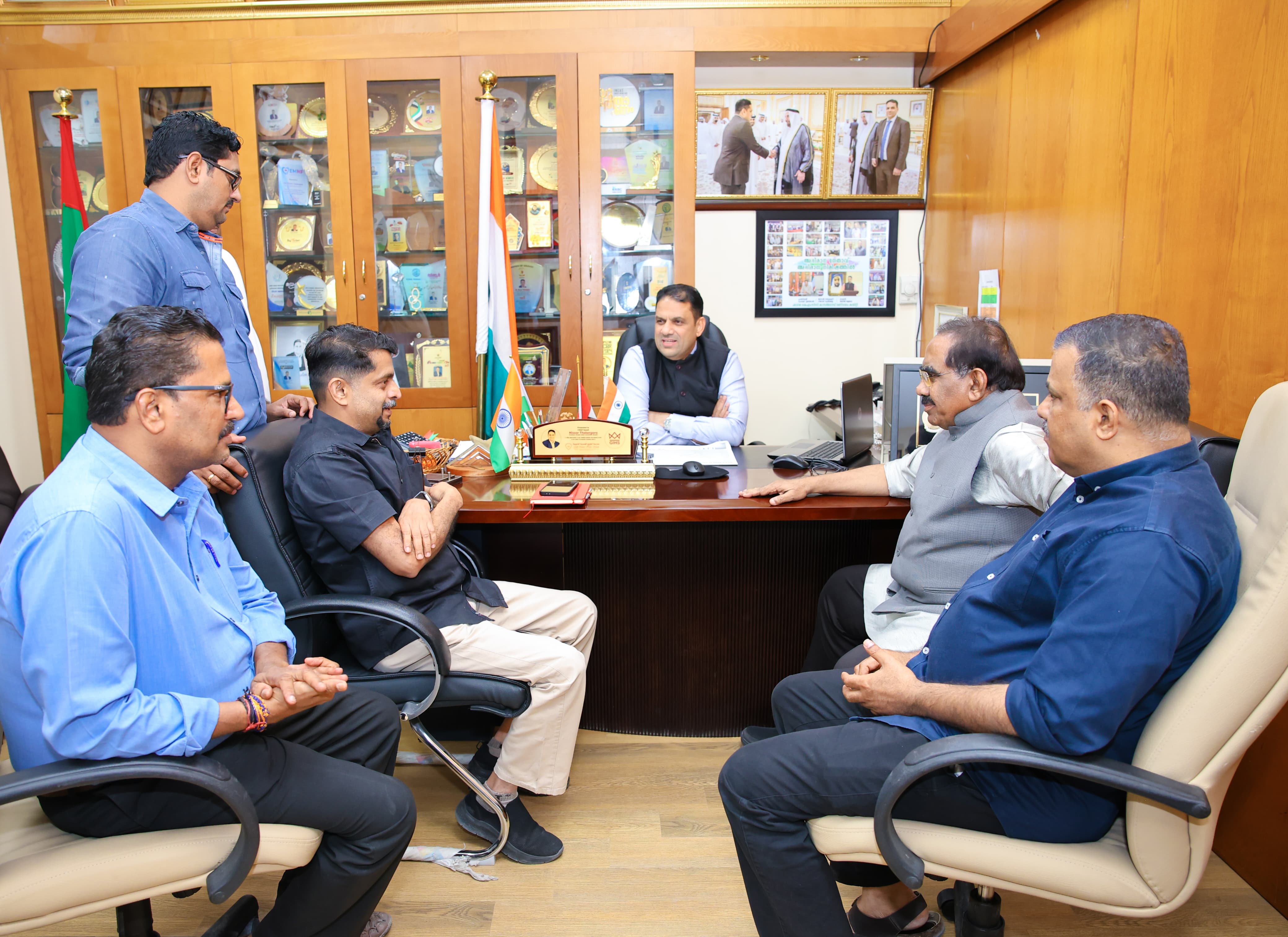 Administrative meeting around office desk